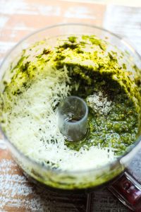 honey goat cheese almond pesto ingredients in a food processor