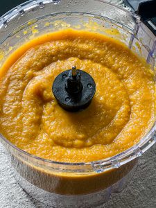 blended roasted vegetables butternut squash in food processor with kettle & fire vegetable broth