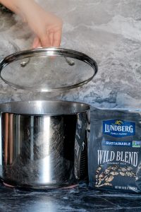 Wild rice being boiled in a pot full of water
