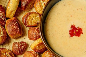 Soft pretzel bites with smoked gouda cheese dip.