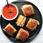 Air fryer Italian sliders on a black plate with a side of marinara - heavenly spiced food blog pinterest pin.
