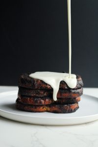 Cookies and cream French toast and a cream cheese glaze being poured over top with a dramatic drip.