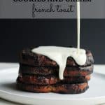 Cream cheese glaze being poured over cookies and cream French toast on a white plate - pinterest pin.