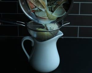 Steeped milk, onion, garlic, and rosemary strained through a fine mesh strainer.