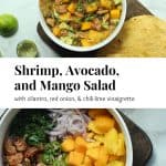 Shrimp, avocado, and mango salad in a bowl on a cutting board with tostadas and the ingredients in a bowl before mixing.